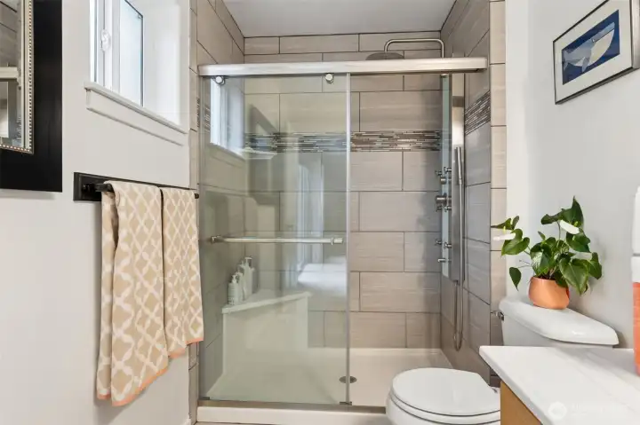 The fully remodeled, designer tile step in shower makes preparing for or recovering from your day luxurious. A multiple head system provides jetted streams on many levels plus rain shower and shower wand too. Ahhhh... The fully remodeled, designer tile step in shower makes preparing for or recovering from your day luxurious. A multiple head system provides jetted streams on many levels plus rain shower and shower wand too. Ahhhh...