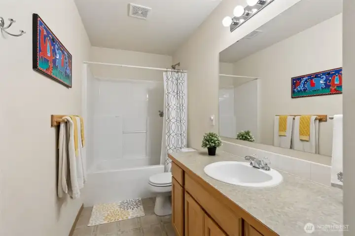 The secondary full, upstairs bath provides a soaking tub and loads of bathroom storage space. The secondary full, upstairs bath provides a soaking tub and loads of bathroom storage space.