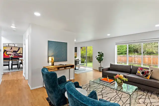 Enjoy the flow and bright layout of the main floor that opens to a spacious yard backed by a private greenbelt.