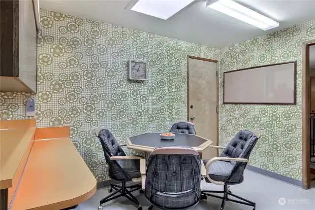 Kitchen eating space has a breakfast bar if one chooses to remove the table.