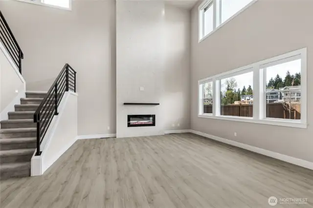 Actual home open living area with soaring ceilings! Lots of natural light!