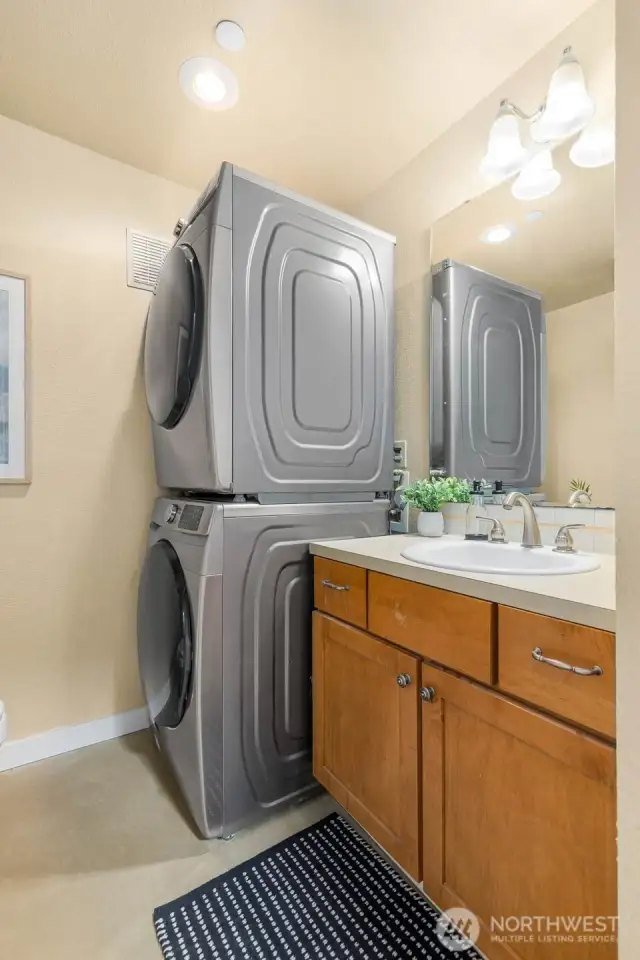 ...to the guest 1/2 bathroom with Washer and Dryer (stays with home)