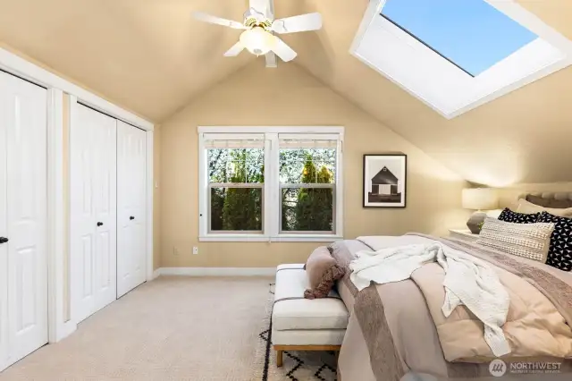 Upstairs primary boasts it's own skylight, ceiling fan and large closet space