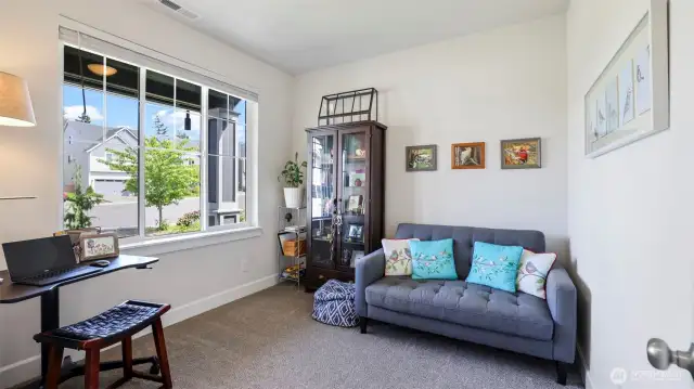 Versatile living area perfect for a second living room, home office, or relaxing retreat