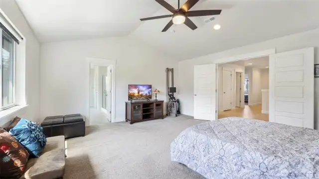 Step through charming French doors into the primary suite, featuring convenient en suite bathroom access