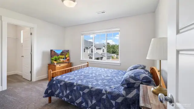 Bedroom #1 boasts abundant natural light and a roomy walk-in closet