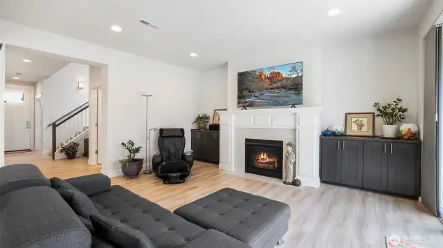 Cozy up by the fireplace in this elegant and inviting living room