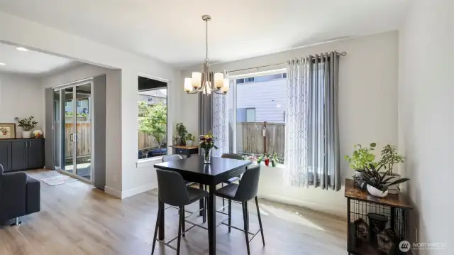 Enjoy meals with a view in this dining room wrapped in natural light from surrounding windows