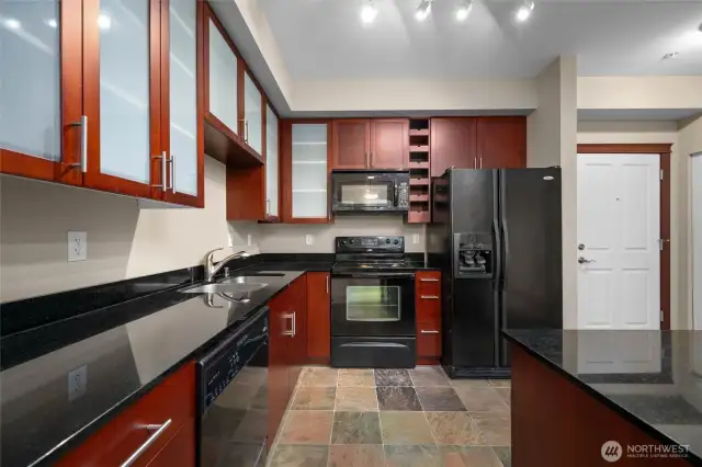 Kitchen with slate floors and custom cabinetry