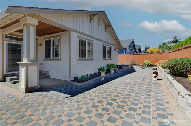 Extended expanded patio with raised beds.