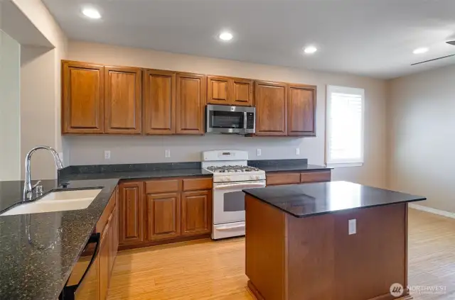 Kitchen has upgraded cabinetry and quartz counter tops.