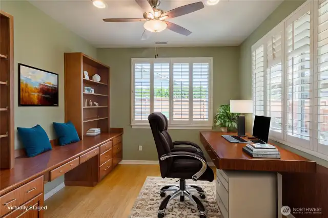 Den, virtually staged.  Notice the plantation shutters.  This room looks out onto the private back yard.