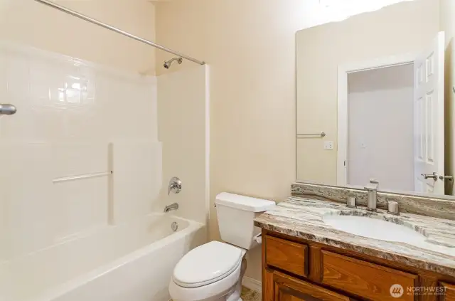Full hall bath.  Updated newer quartz counter top.