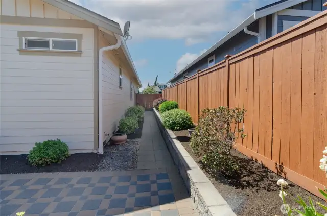 Paved walk way and additional raised bed areas.