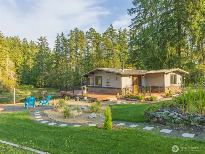 Beautiful waterfront home with easy to maintain landscaping that feels like you're in your own private park. Lots of areas for entertaining or just enjoying the conversation areas for yourself. This home also includes a buildable lot across the street that has been transformed into another private park for your enjoyment