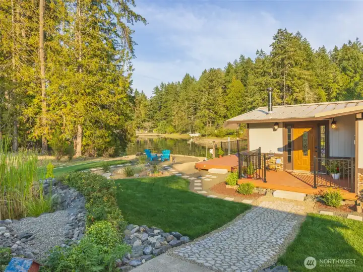 This lovely entrance to the updated home with 2 bedrooms, 1 bath and fresh paint, inside and out. A new 3 BR septic system that can be upgraded if you build on the lot across the street