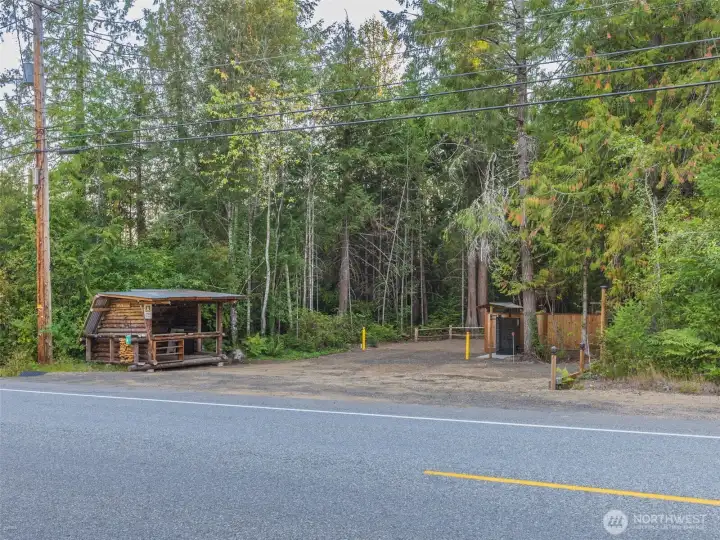 Entrance to property across the street to  beautiful  acreage that has been parked out and holds the septic and drainfield for the primary home and you can build a new home and expand the drainfield