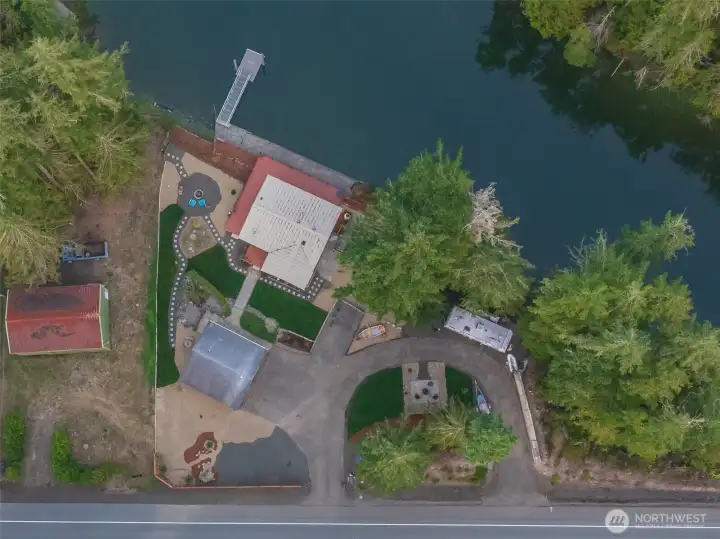 Areal view of your beautiful, well situated waterfront oasis, that includes the buildable acreage across the street