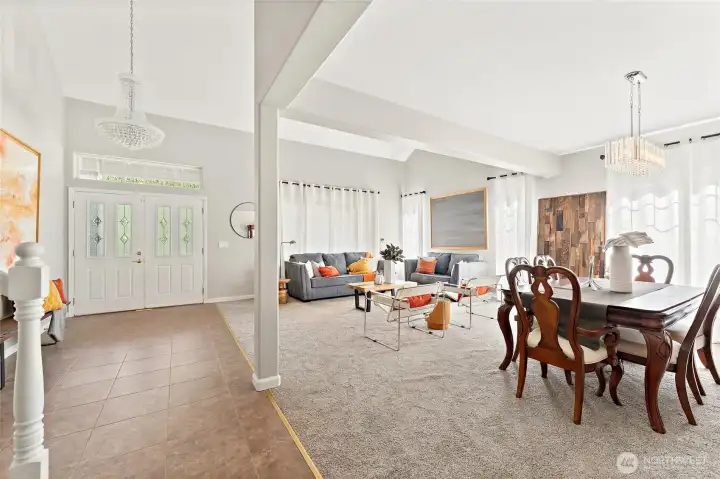 Natural light and gorgeous chandeliers illuminate this space
