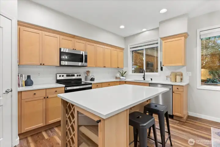 granite counters, new appliances, beautiful backsplash