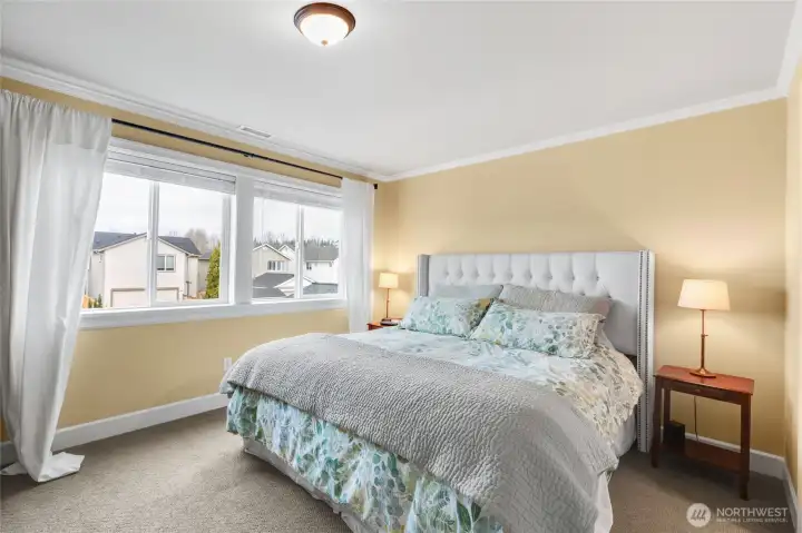 Crown molding and wood wrapped windows add elegance and warmth.