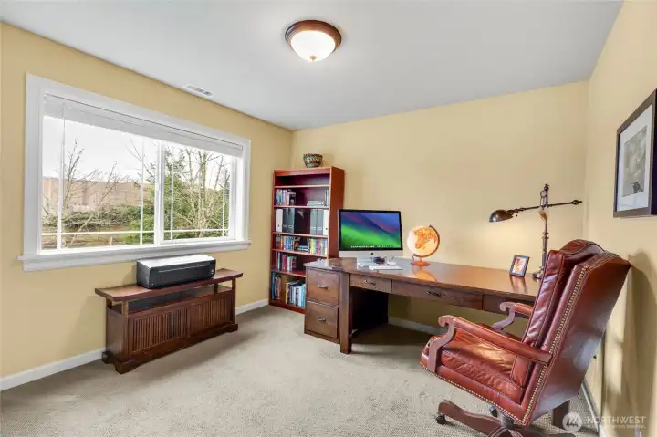 One of the three bedrooms has a serene Mt. Si and mountain view.
