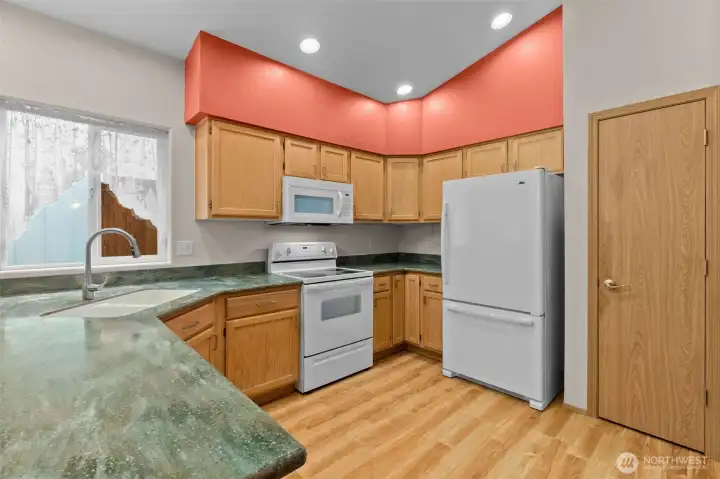 Updated solid surface counters, flooring and newer appliances.