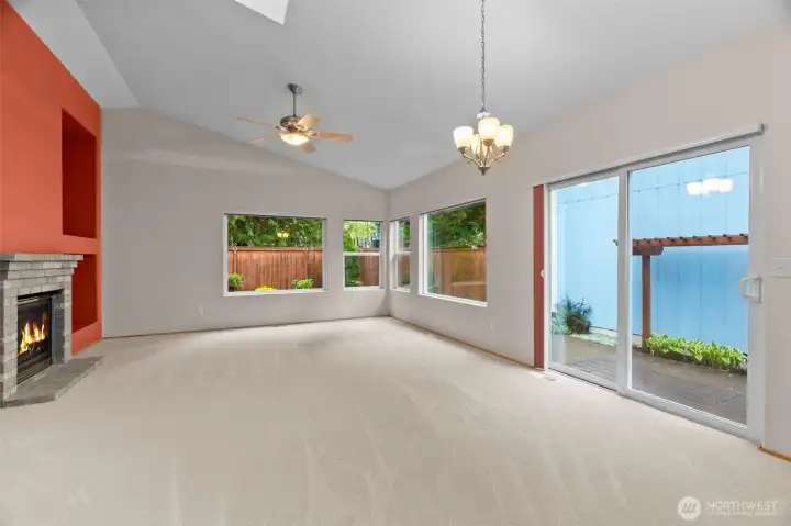 living space with sky light and window to view of courtyard