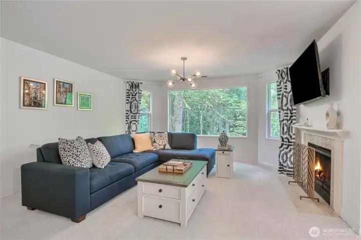 Living room with breathtaking views, newly painting interior, warm cozy wood burning fireplace.