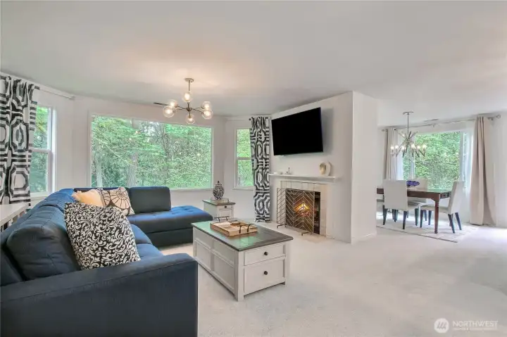 Living/dining areas are flooding with light and panoramic tree views. You cannot beat the privacy or views on all sides of this condo!