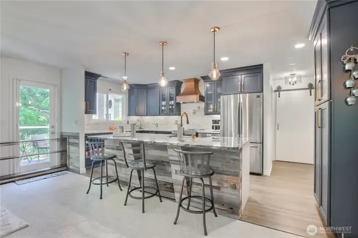 Pendant lighting, pantry space (additional space behind barn door can be used as pantry), pop-up charging stations. Pendant lighting, pantry space (additional space behind barn door can be used as pantry), pop-up charging stations.