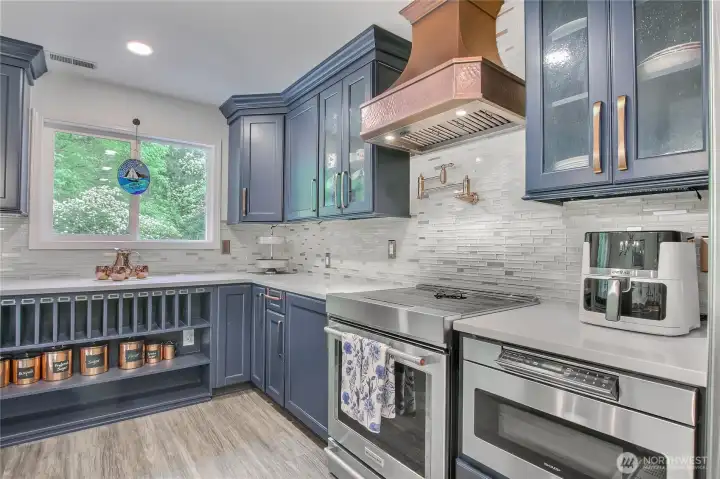 Copper hood. Induction Stove with all the bells and whistles! Pot filling faucet.