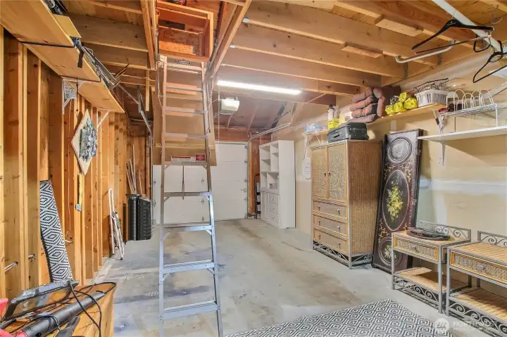 1-car deep garage with pull down ladder and lift/elevator for convenience of moving items up/down.