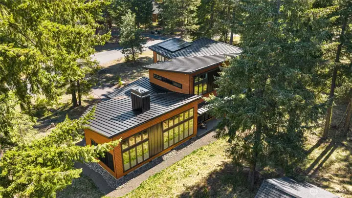 A mountain modern design showcases both the home and the stunning surroundings.