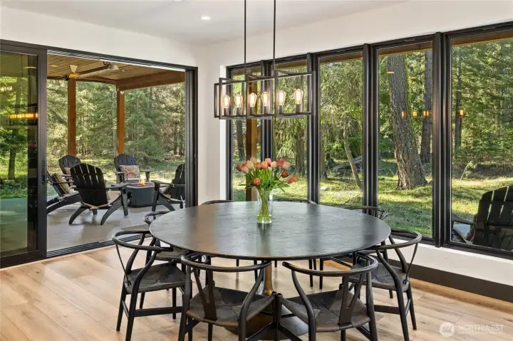 Multi-slide glass doors off the dining area seamlessly extend the living space into the great outdoors.