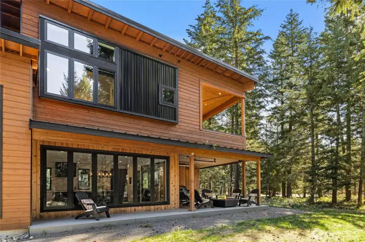 Additional covered patio space extends along the rear side of the living room.