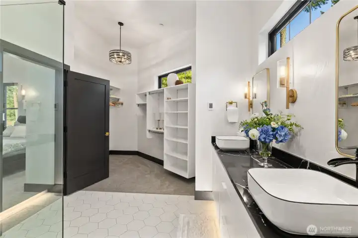 The primary bath flows into the closet area specifically for ADA accessibility. This design ensures easy movement and usability for individuals with disabilities, creating a more inclusive and comfortable living space.