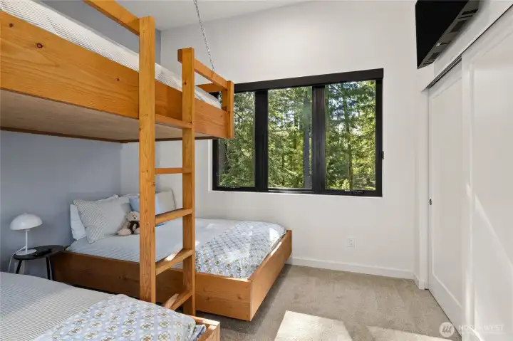 The bunk beds are custom and built-in so they definitely stay with the home.