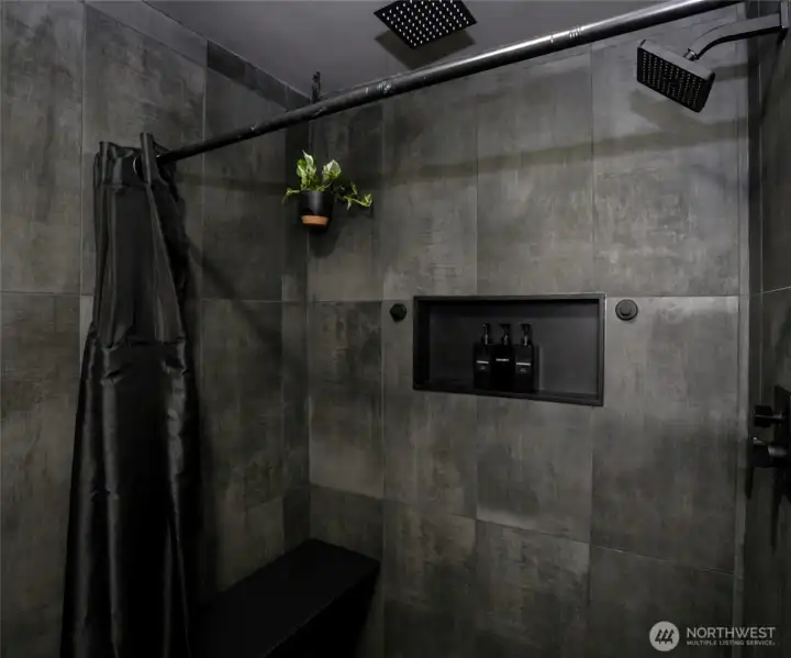 Fully tiled master bathroom shower with dual shower heads