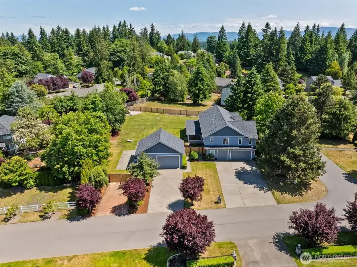 Side view of home showing 3 car attached garAge w/ workspace AND 2 car detached w/ workspace & height for car lift! Side view of home showing 3 car attached garAge w/ workspace AND 2 car detached w/ workspace & height for car lift!