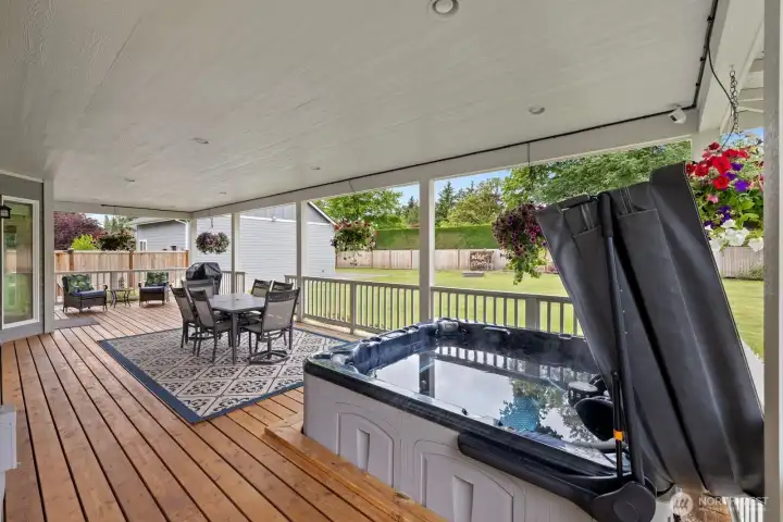 Wrap around porch with so much space and a gleaming hot tub! Perfect for year round use! Wrap around porch with so much space and a gleaming hot tub! Perfect for year round use!