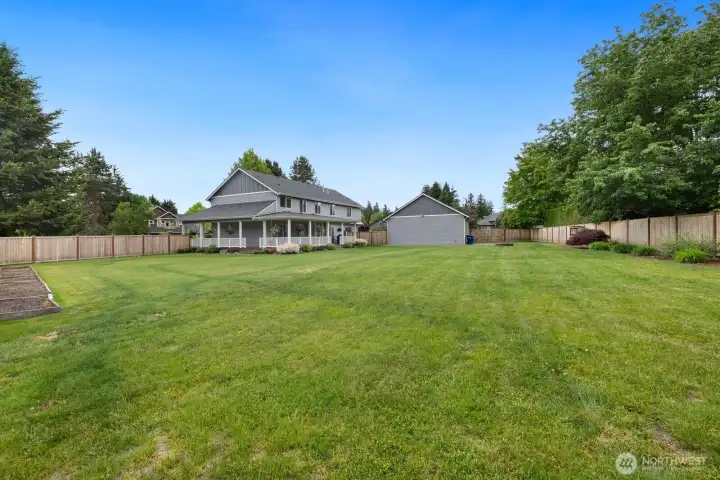 Sitting on a flat almost fully fenced acre! Play set, raised beds, DETACHED GARAGE, RV pad / parking, hot tub and amazing wrap around covered porch! Sitting on a flat almost fully fenced acre! Play set, raised beds, DETACHED GARAGE, RV pad / parking, hot tub and amazing wrap around covered porch!