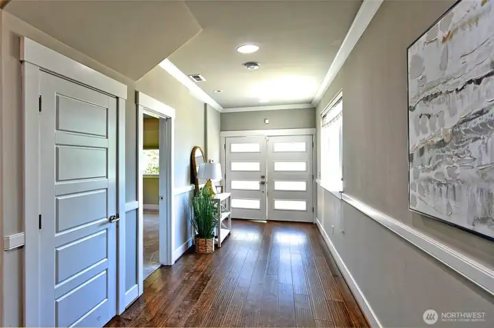 Welcoming entry foyer with hardwood floors and plenty of natural light.