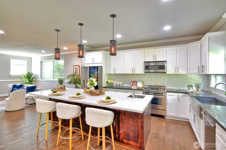 Large center island provides additional prep space and casual seating.