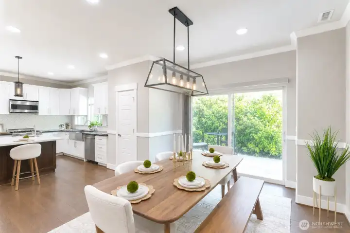 Dining area overlooking the backyard, perfect for indoor-outdoor entertaining. Dining area overlooking the backyard, perfect for indoor-outdoor entertaining.
