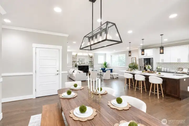Spacious dining room with open sightlines to the kitchen and living spaces. Spacious dining room with open sightlines to the kitchen and living spaces.