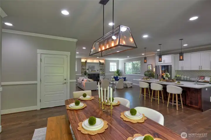 Spacious dining room with open sightlines to the kitchen and living spaces.