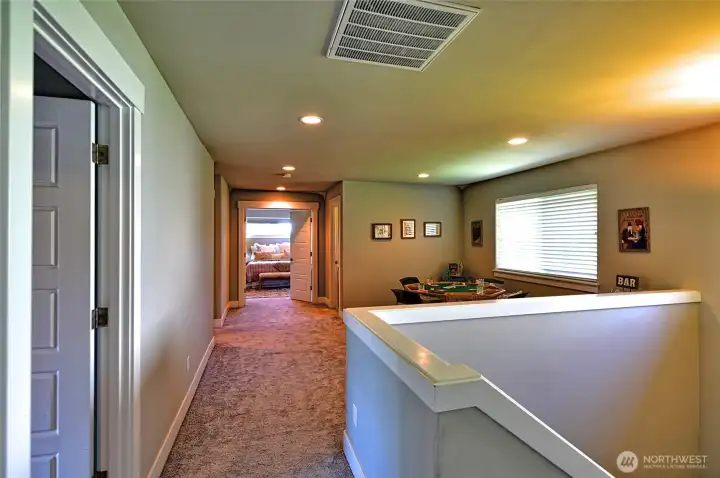 Upper-level landing provides additional living and flex space.