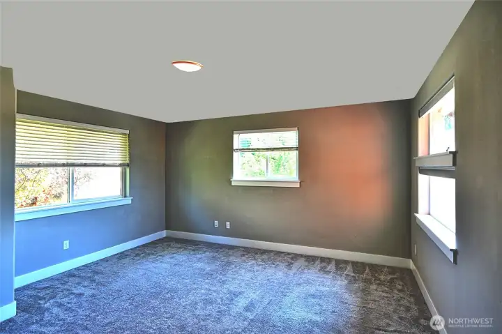 Additional primary bedroom upstairs.