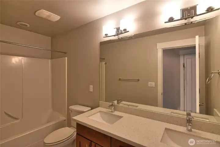 Full bathroom conveniently located near secondary  bedrooms.